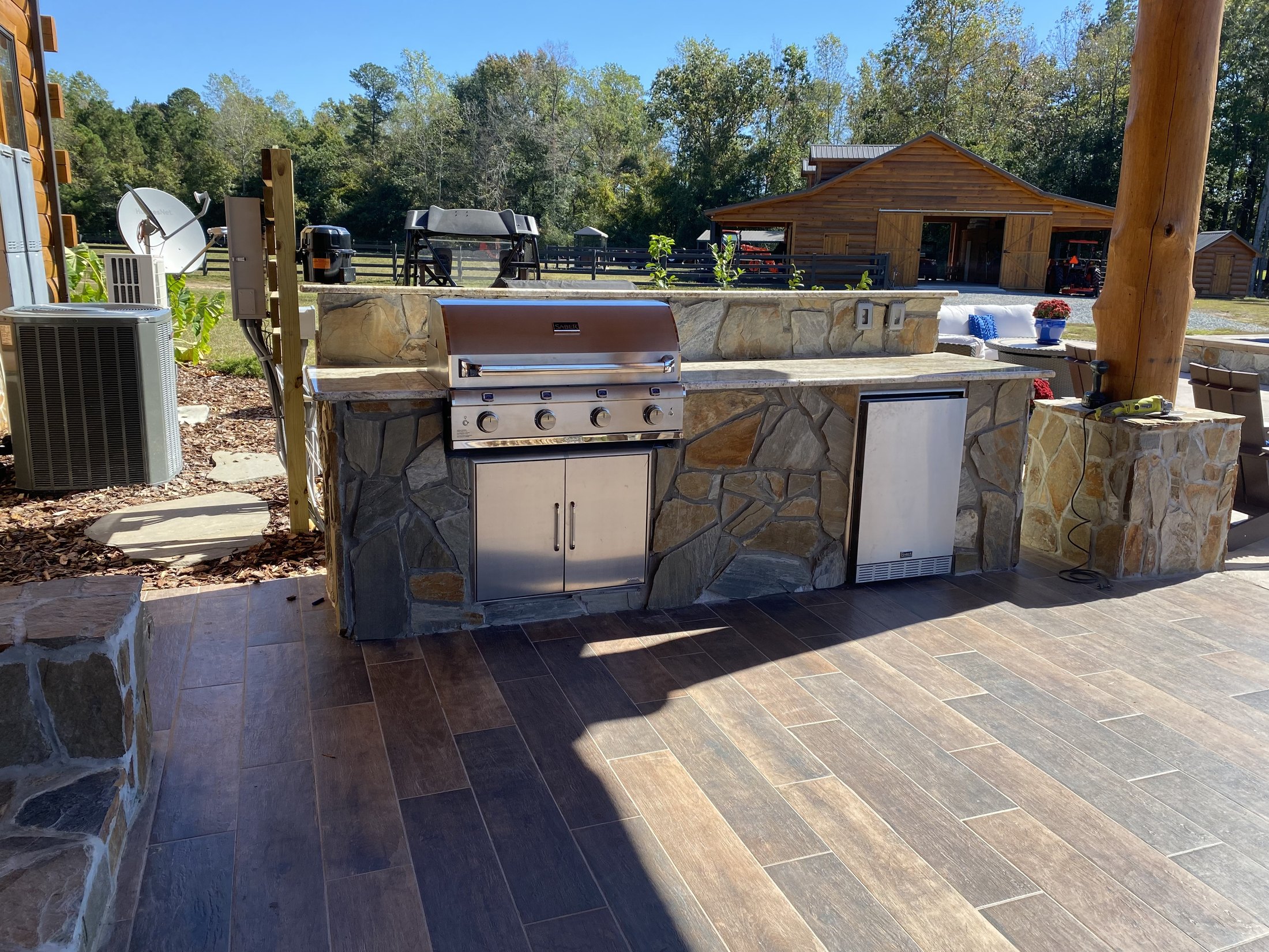 Custom stone outdoor kitchen by JW Masonry SC