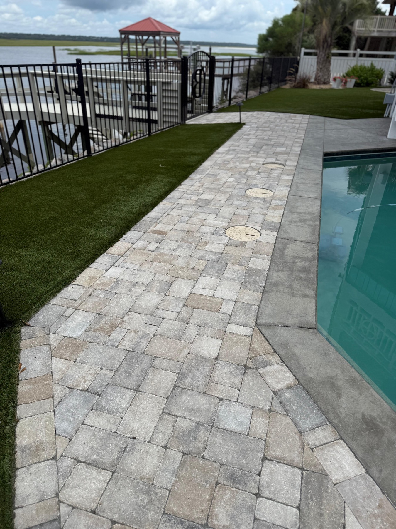 Poolside paver walkway by JW Masonry SC